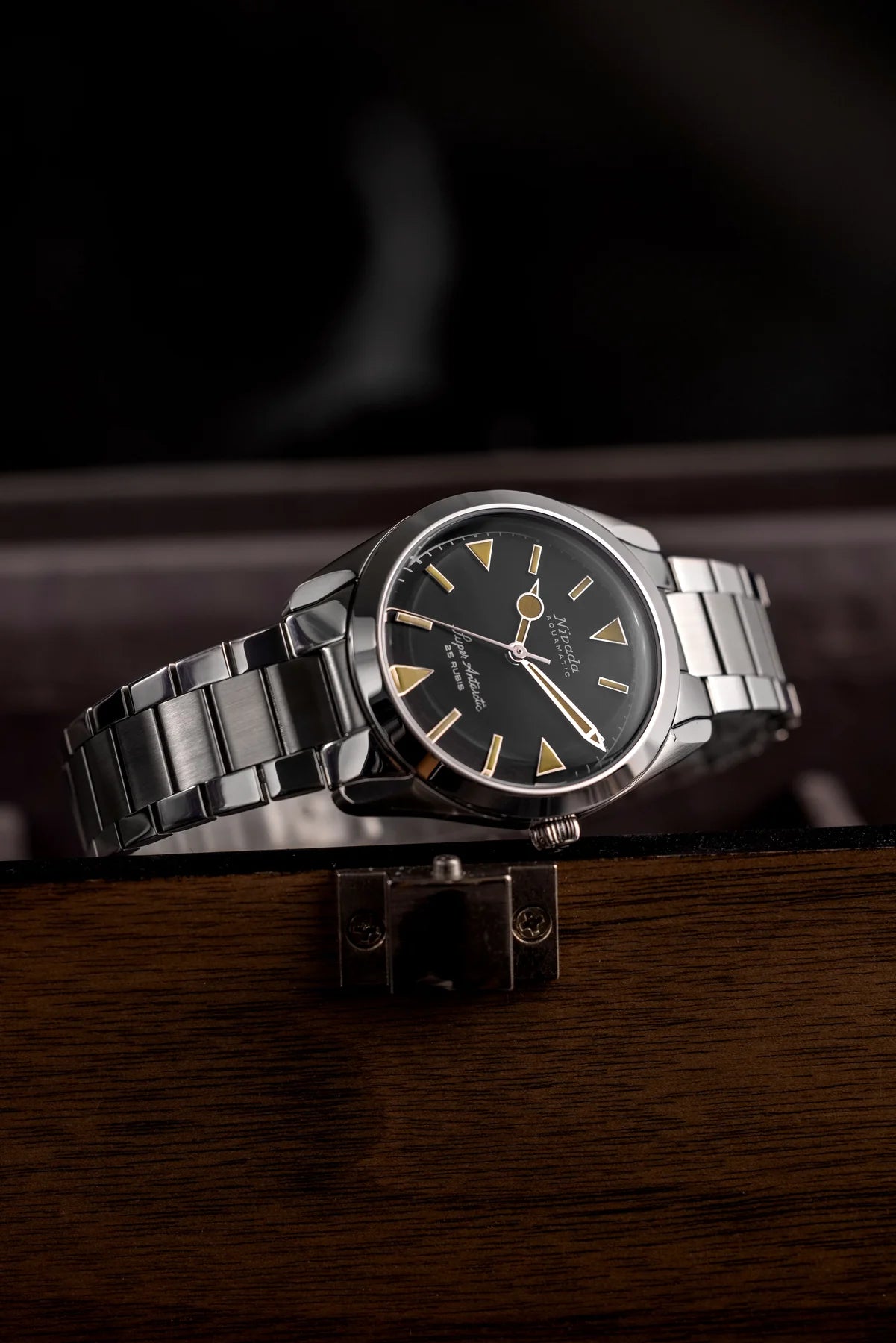 Side profile showing slim 11.1mm stainless steel case and sapphire crystal