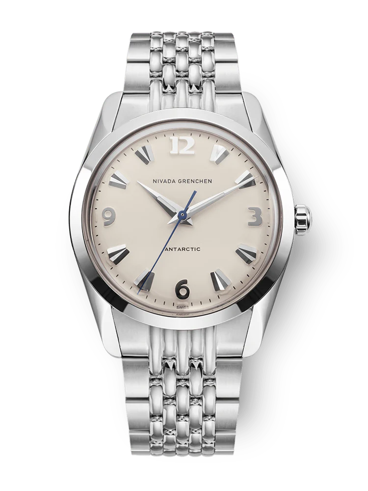 Silver watch with a beige face on a white background Nivada Grenchen Antarctic Eggshell 