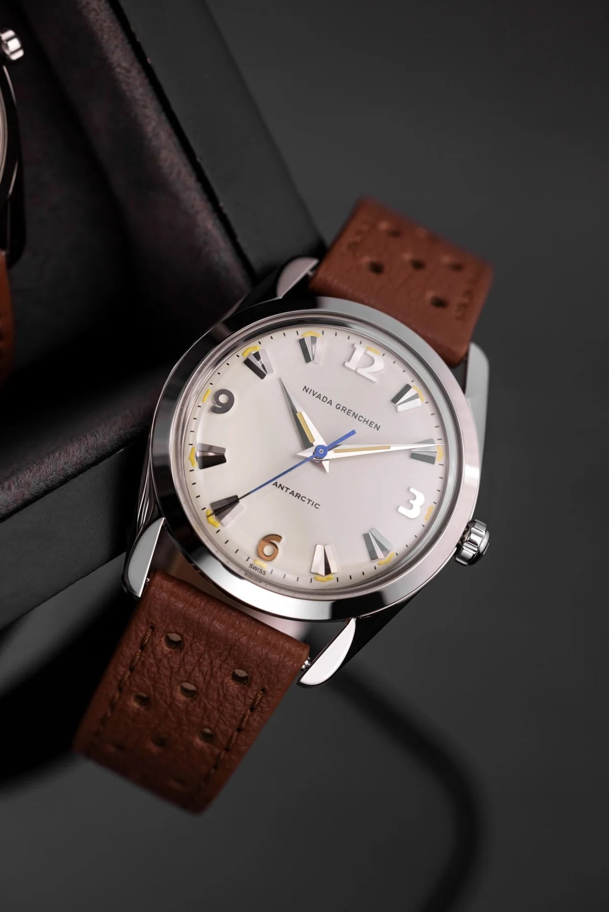 Nivada Grenchen Antarctic Eggshell Dial Beige Luminova Watch with brown leather strap on a dark background