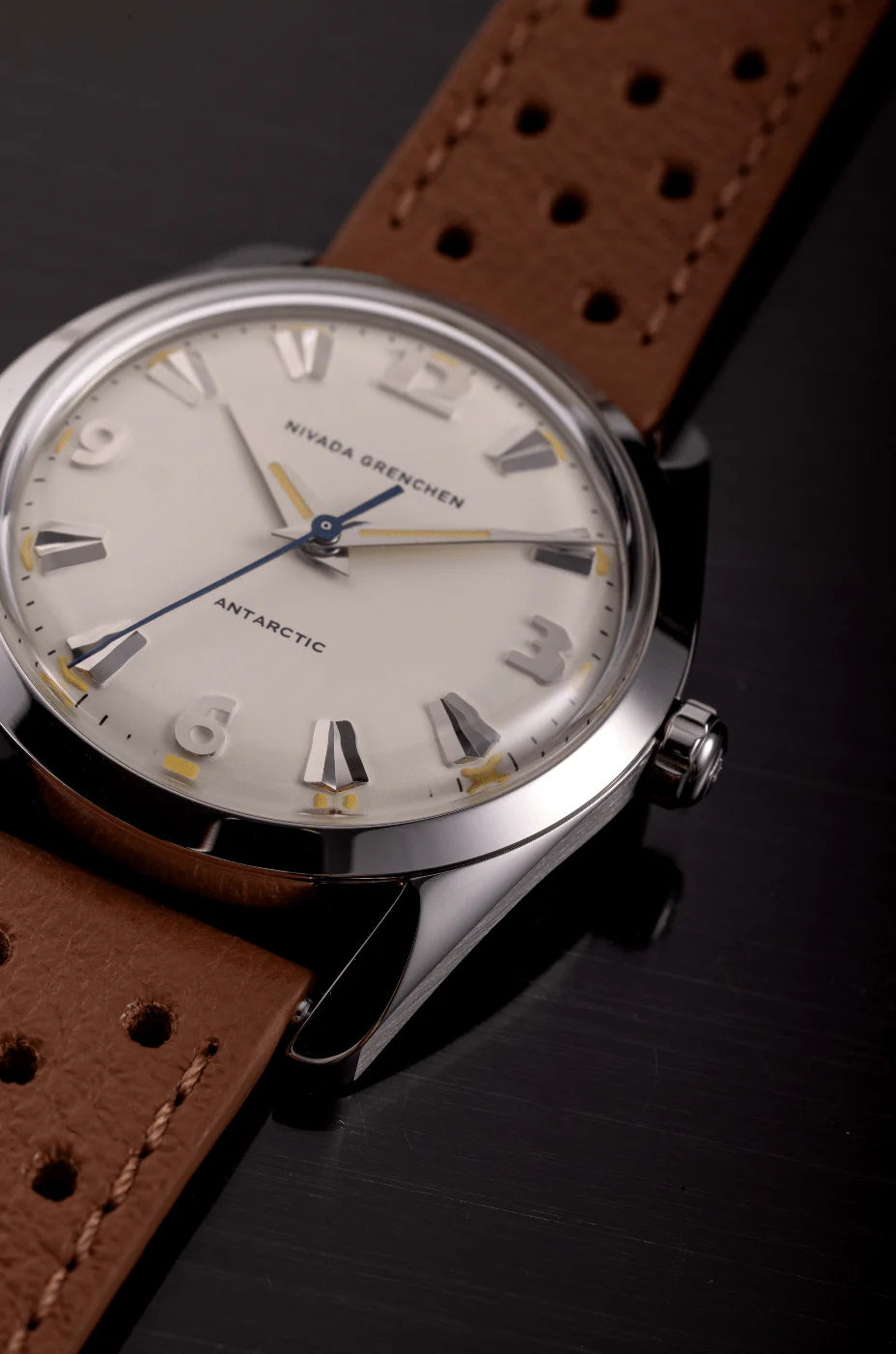 Nivada Grenchen Antarctic Eggshell Dial Beige Luminova Watch with a brown leather strap on a dark background