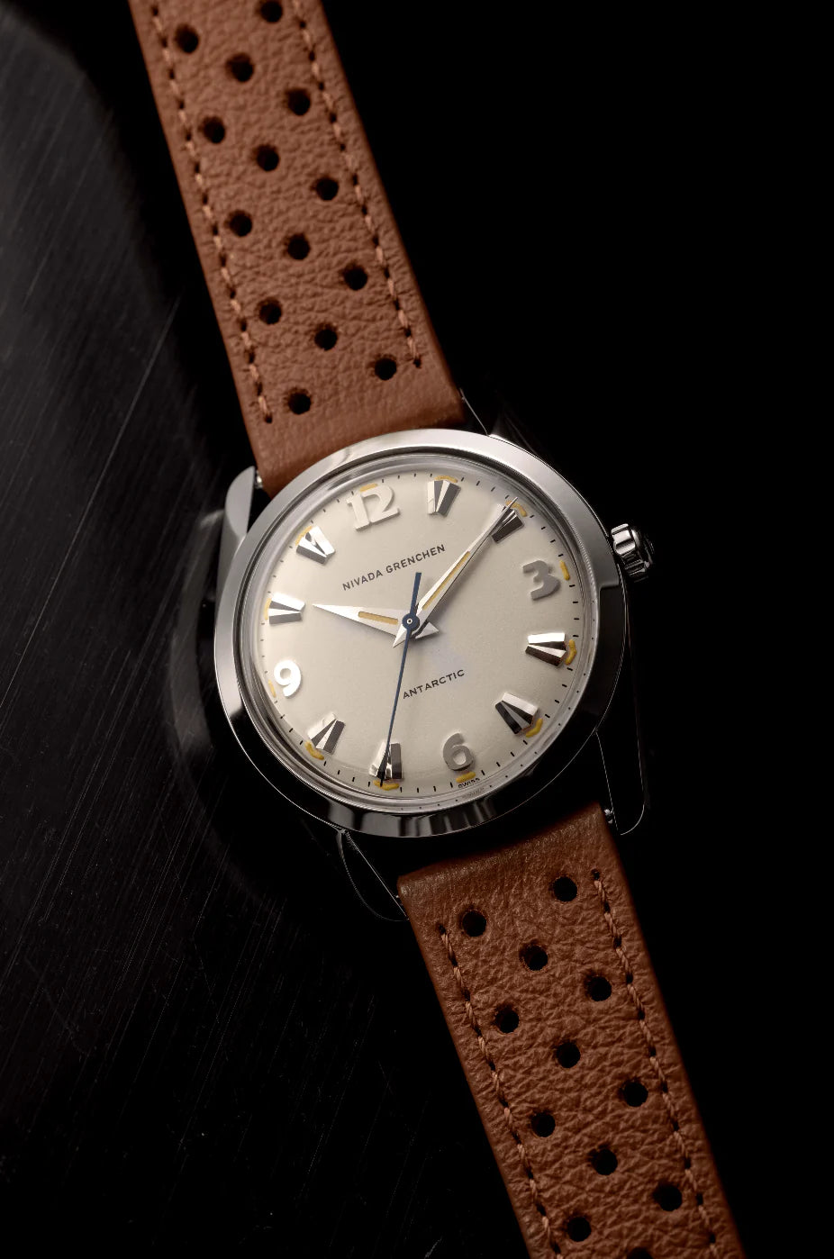Nivada Grenchen Antarctic Eggshell Dial Beige Luminova Watch with a brown leather strap on a black background